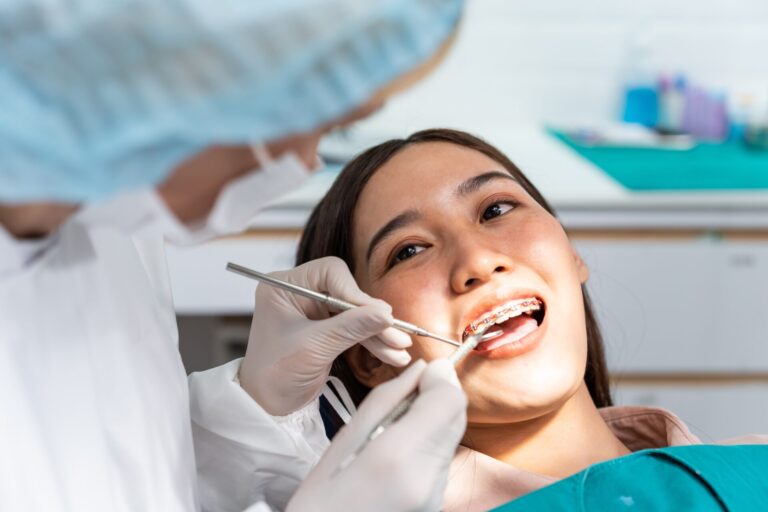 Orthodontist,Doctor,Examine,Tooth,To,Woman,Patient,At,Dental,Clinic.