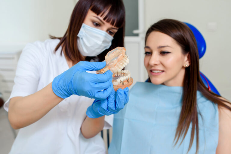 Close,Up,Of,Young,Woman,Dentist,Explain,To,The,Patient